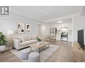 A modern living room with a white sofa, a wooden coffee table, and a flat-screen TV.