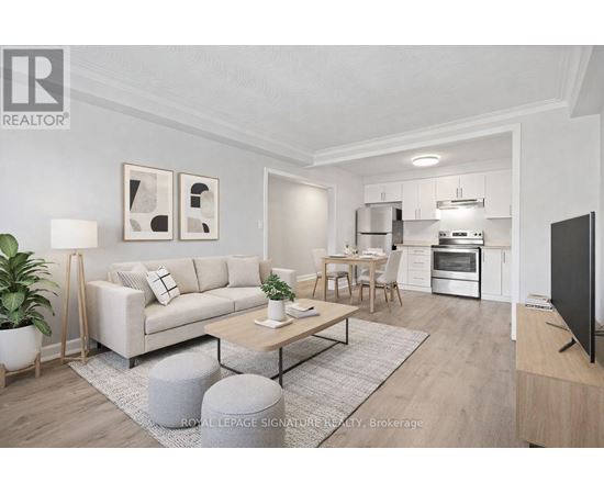 A modern living room with a white sofa, a wooden coffee table, and a flat-screen TV.