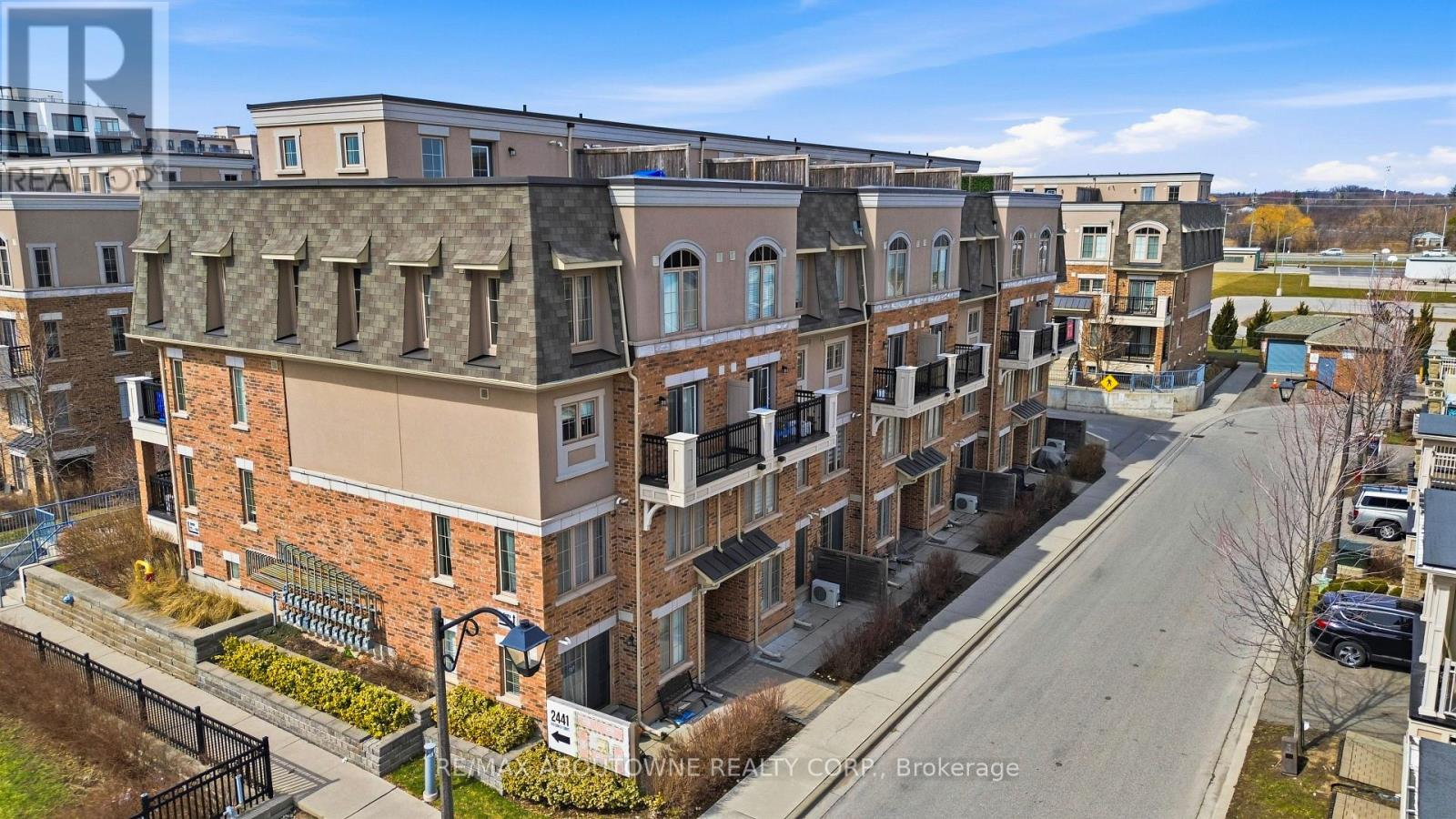 A street view of a residential area with apartment buildings.