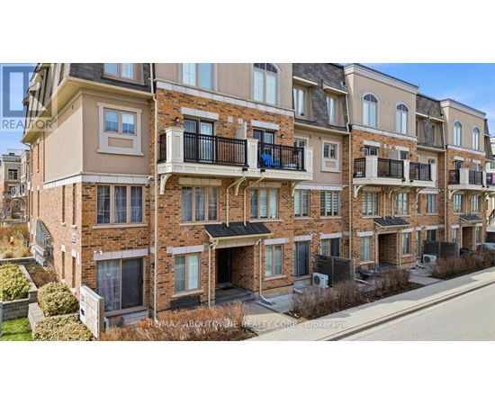 A row of apartment buildings with balconies and windows.
