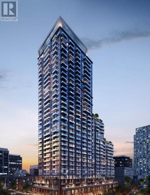 A tall, modern building with a glass facade is the focal point of the image.