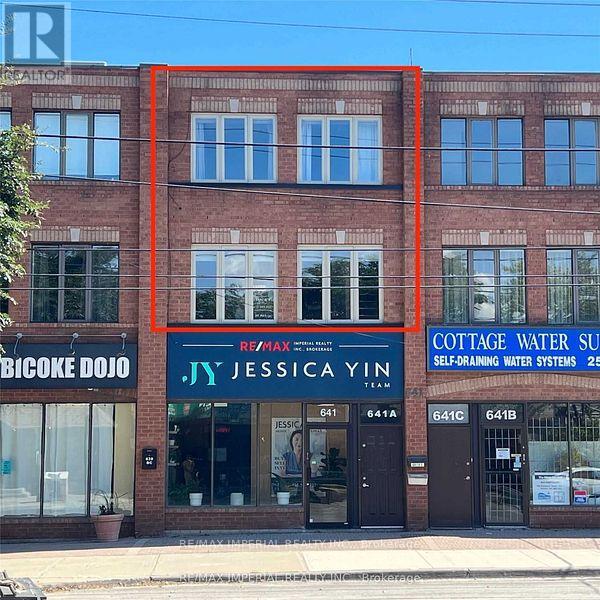 A building with a red frame around it and a store front with the name JESSICA YIN on it.