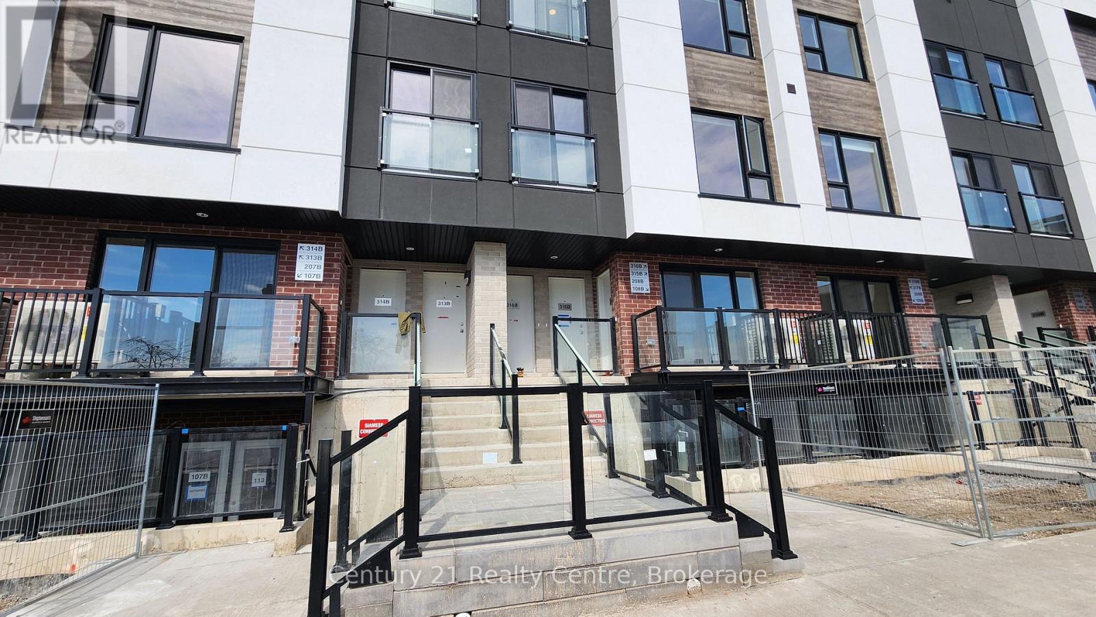 A building with the words Century 21 Realty Centre on the front.