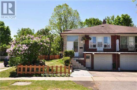 A house with a brown roof and a white garage door is for sale.