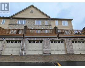A building with a sign that says "Royal LePage Signature Realty, Brokerage".
