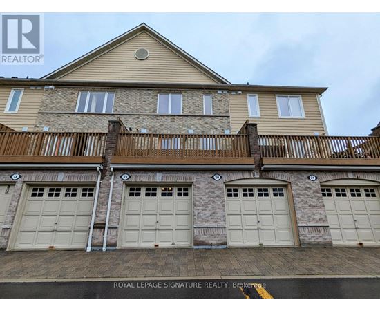 A building with a sign that says "Royal LePage Signature Realty, Brokerage".