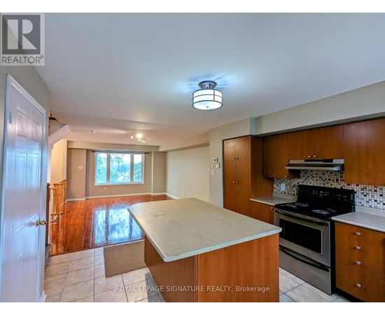 A kitchen with a stove top oven and a counter top.