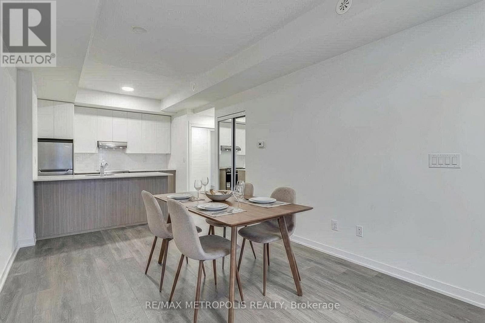 A dining room with a table set for two.