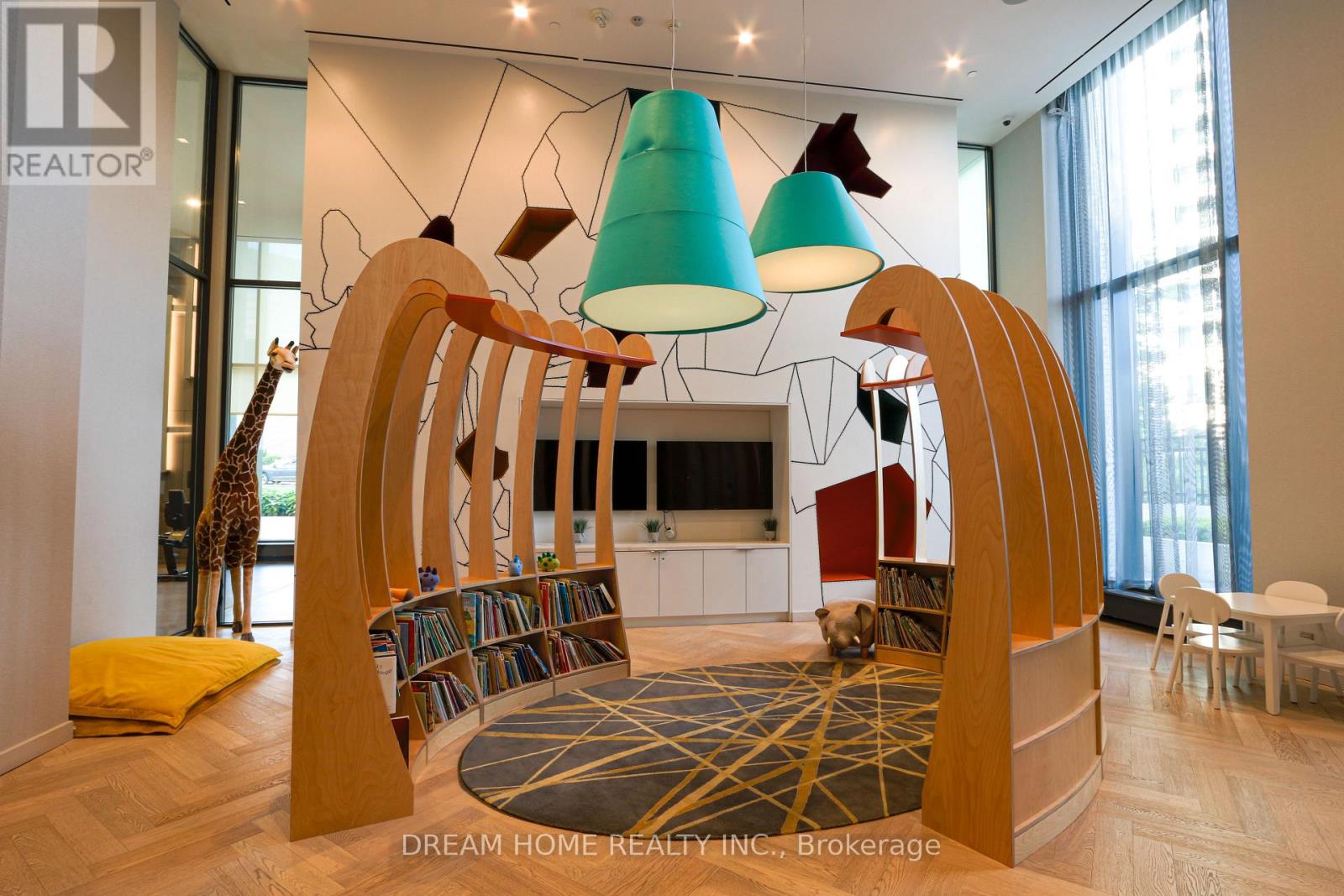 A modern living room with a wooden bookshelf and a giraffe statue.