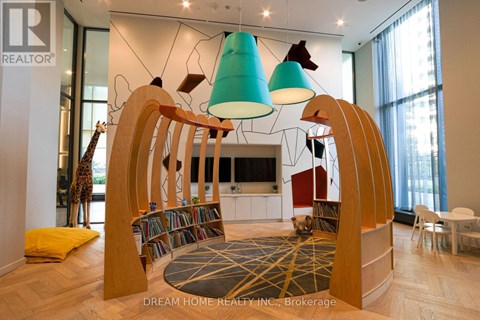 A modern living room with a wooden bookshelf and a giraffe statue.