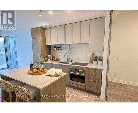 A modern kitchen with wooden cabinets and a central island.