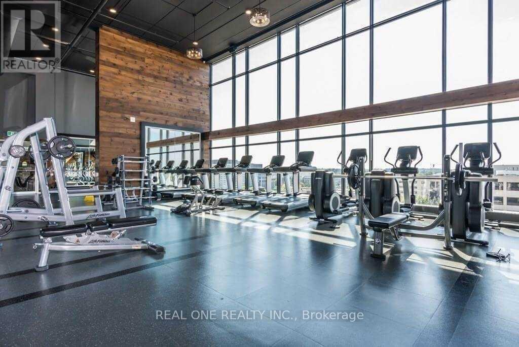 A gym with a variety of equipment including treadmills, weights, and exercise machines.