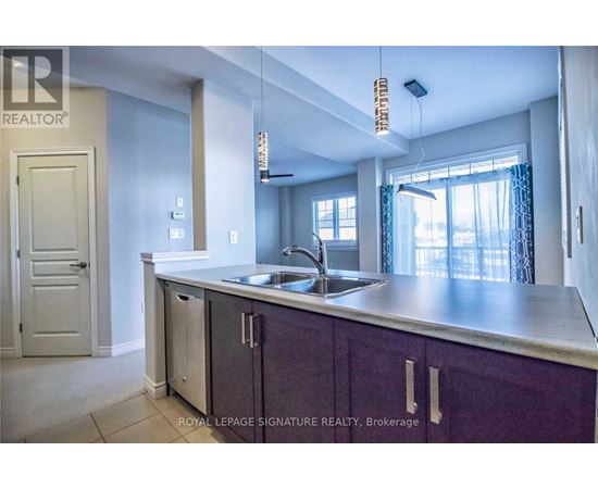 A kitchen with purple cabinets and a sink.