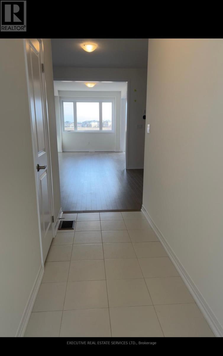 A hallway with a door at the end.