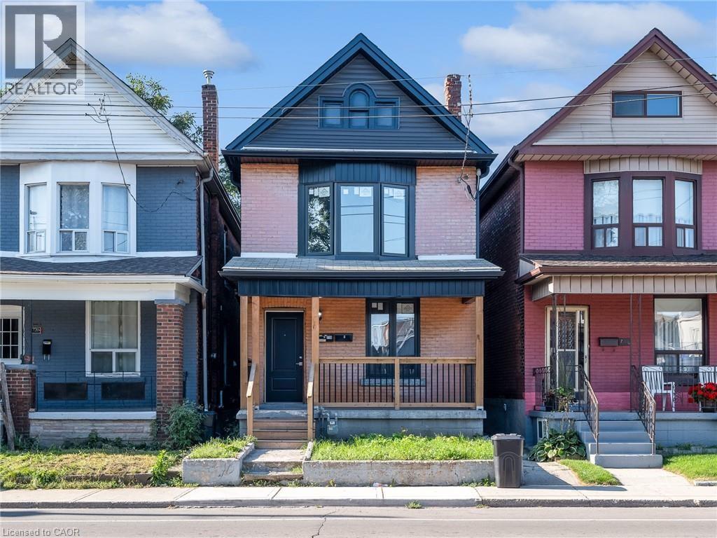 Three houses with different colored fronts are shown.
