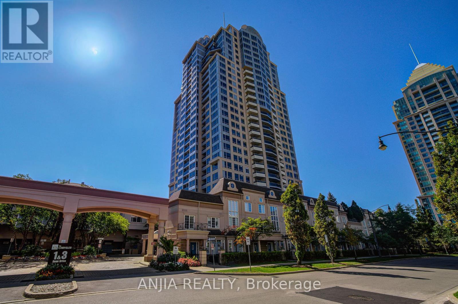 A tall building with a blue sky in the background.