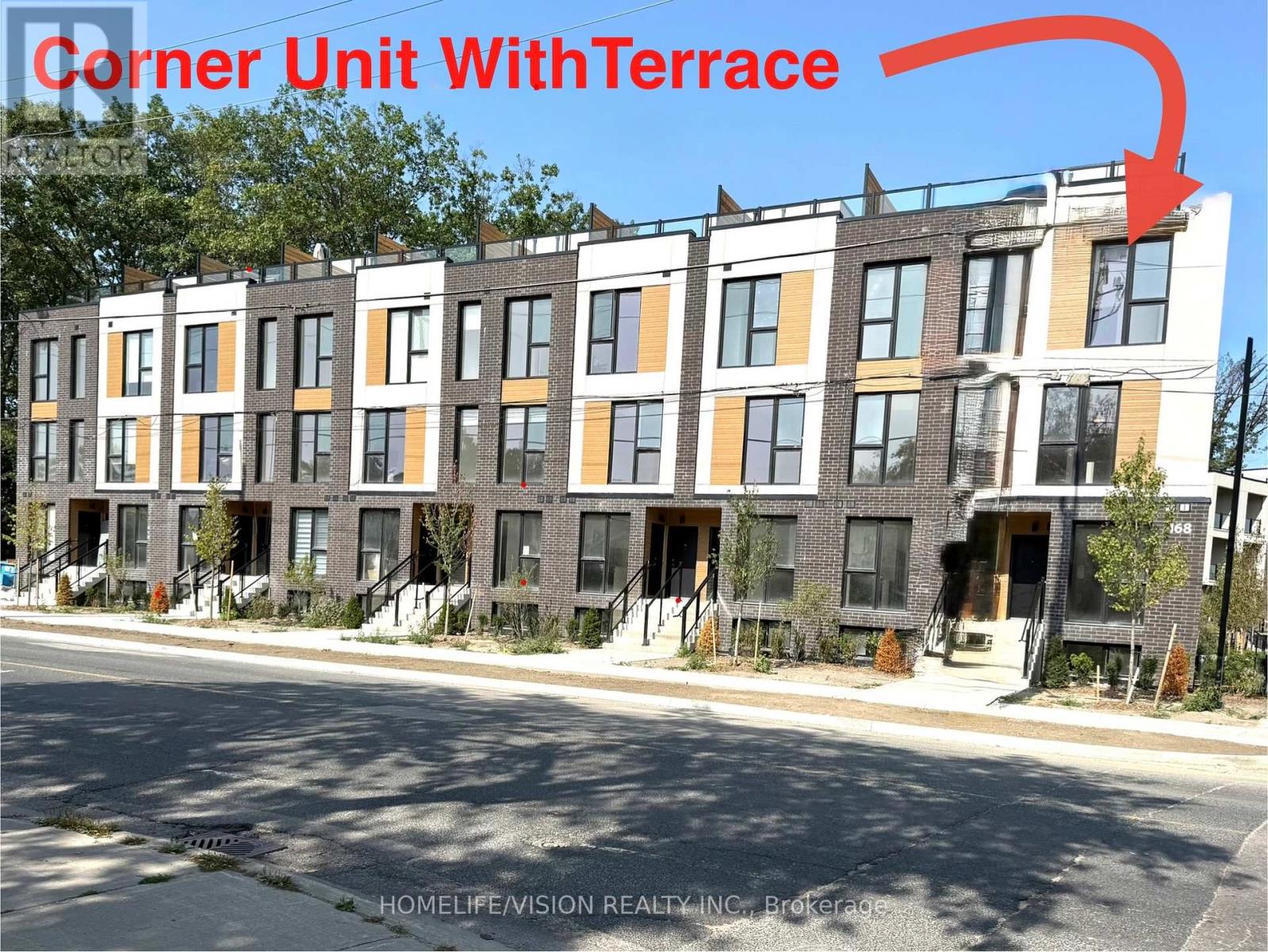 A corner unit with a terrace is highlighted in red on a building.