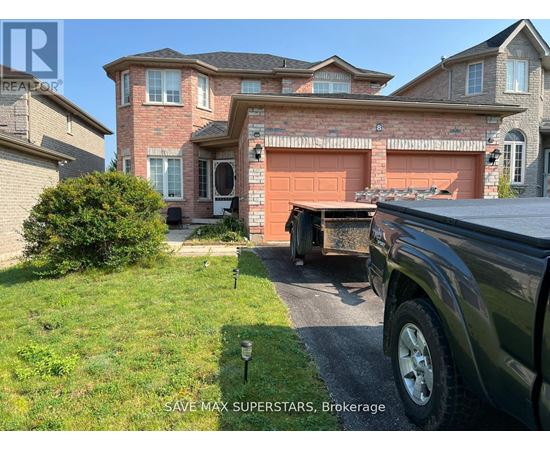 A truck is parked in front of a house with a sign that says "SAVE MAX SUPERSTARS, Brokerage".