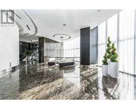 A modern living room with a marble floor and a large window.