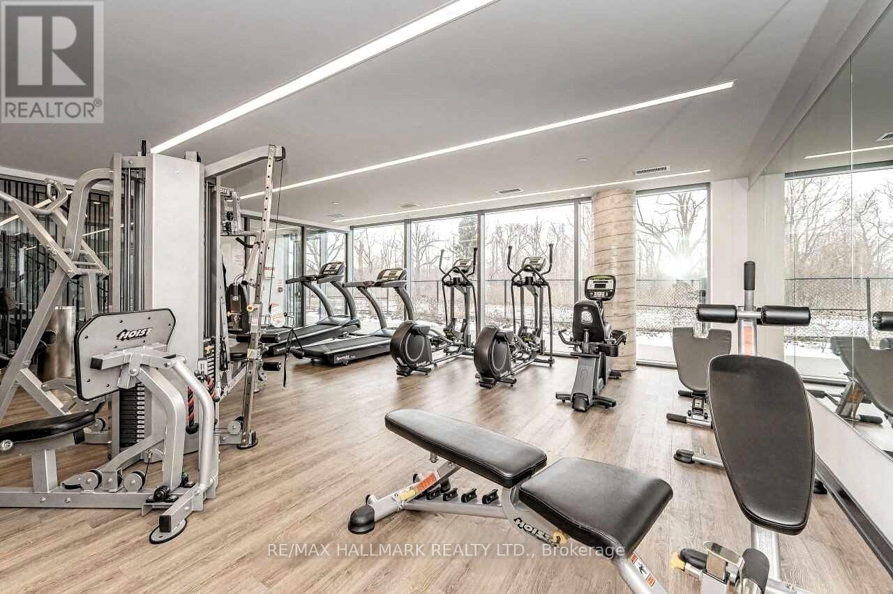 A gym with a variety of equipment including a leg press machine.