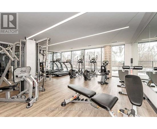 A gym with a variety of equipment including a leg press machine.