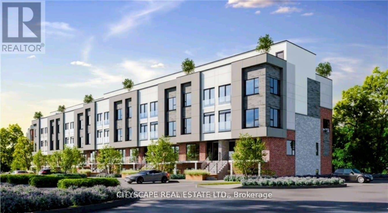 A modern apartment complex with a car parked in front.