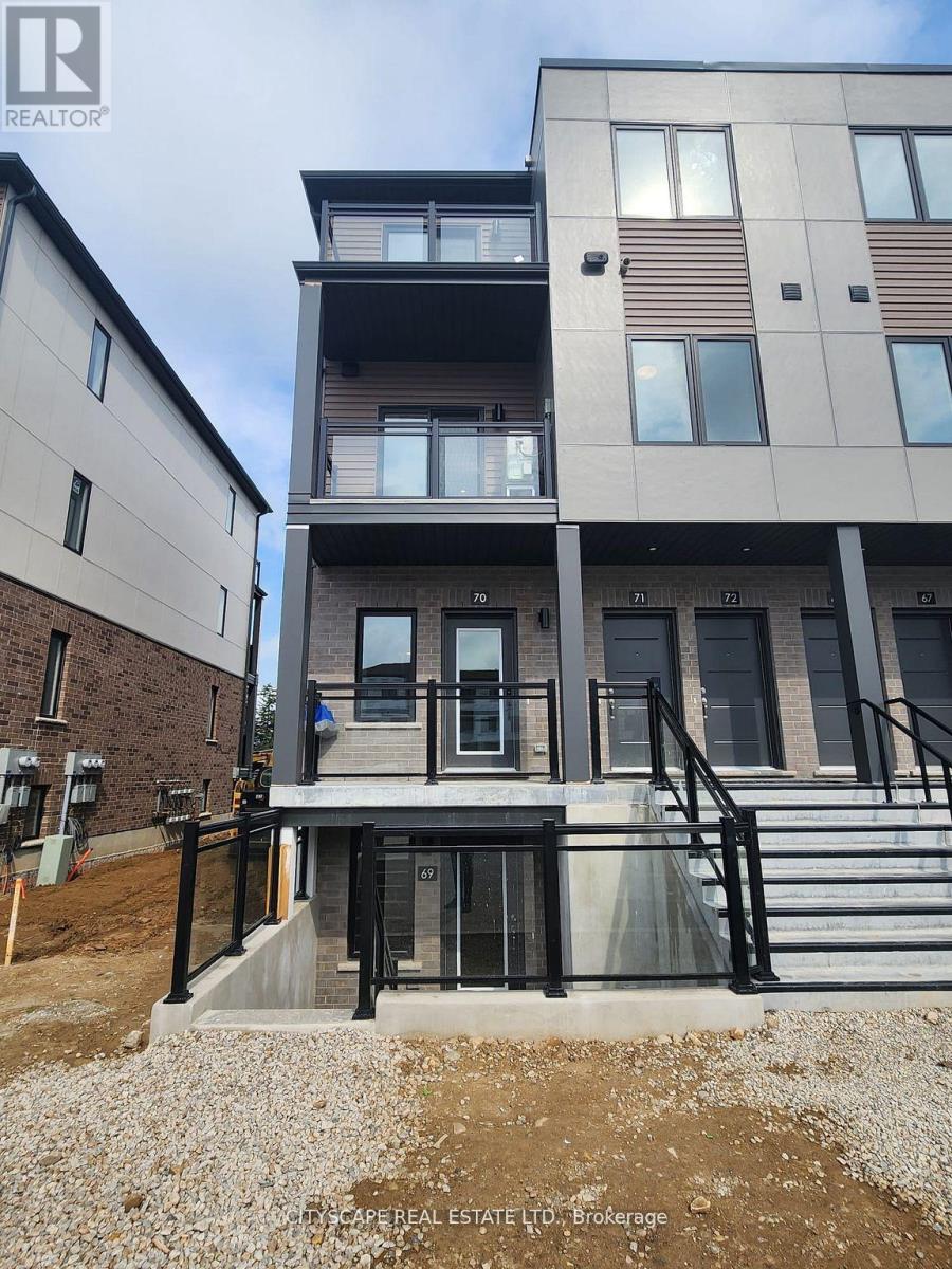 A multi-story building with a balcony and stairs leading to the entrance.