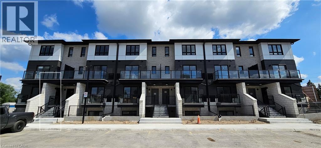 A multi-story building with a balcony on the second floor.