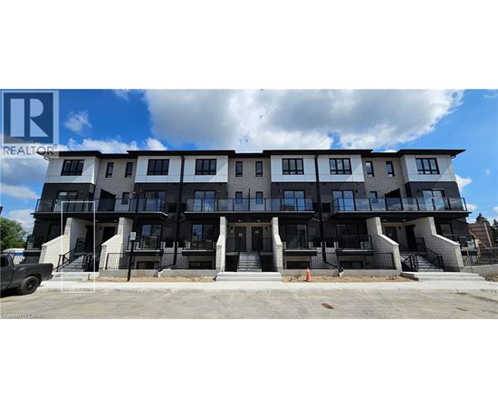 A multi-story building with a balcony on the second floor.