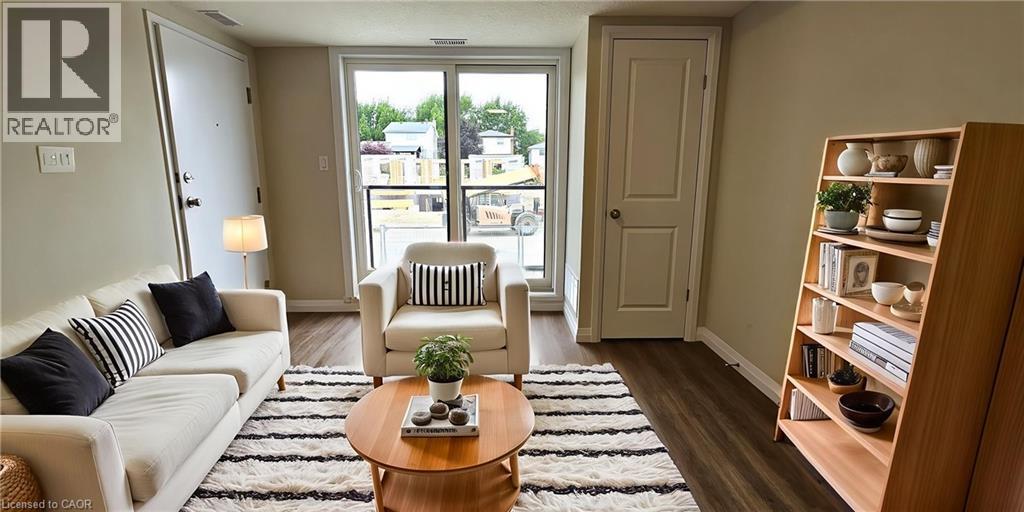 A living room with a white couch, a wooden coffee table, and a bookshelf.
