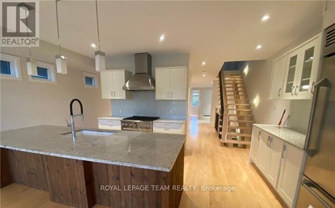 A modern kitchen with a large island in the middle.