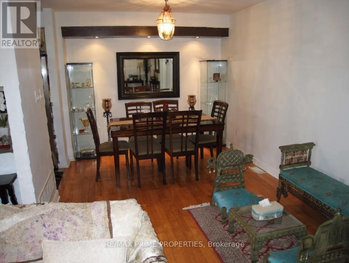 A dining room with a table set for six.