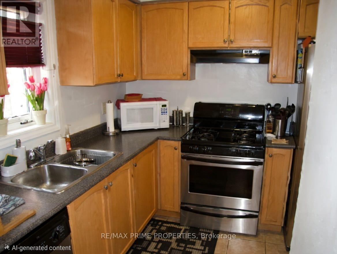 A kitchen with wooden cabinets and stainless steel appliances.