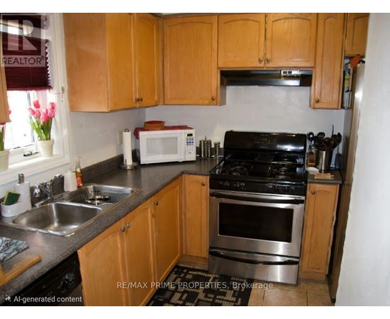 A kitchen with wooden cabinets and stainless steel appliances.