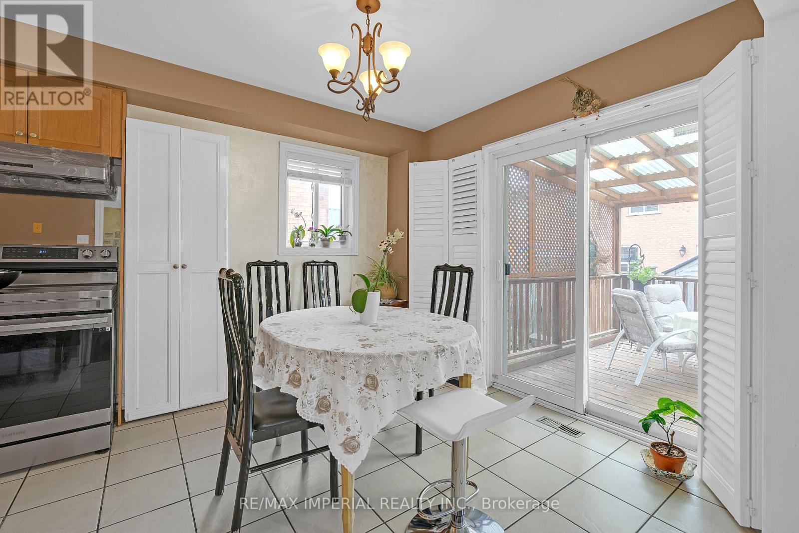 A dining room with a round table set for two.