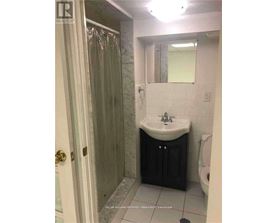 A bathroom with a sink, toilet and shower.