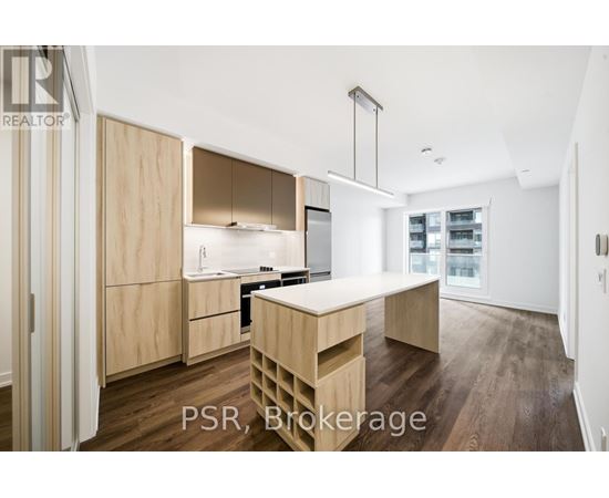 A modern kitchen with wooden cabinets and a central island.