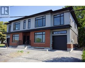 A two-story house with a garage is for sale.