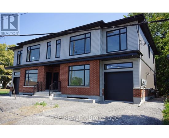 A two-story house with a garage is for sale.