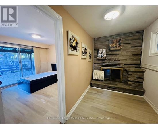 A bedroom with a bed and a fireplace.