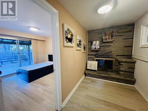 A bedroom with a bed and a fireplace.