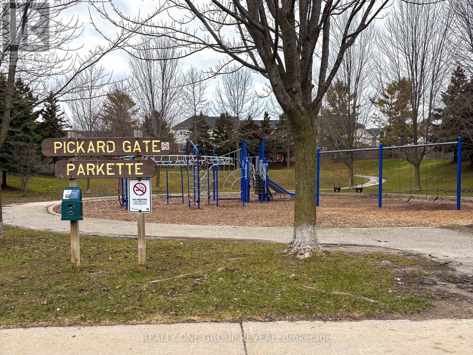 A sign at the entrance of Pickard Gate Parkette indicates that dogs are not allowed.