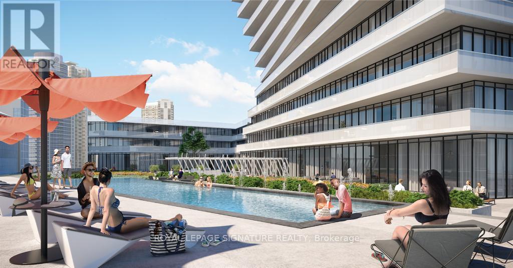 A group of people are sitting by a pool on a sunny day.