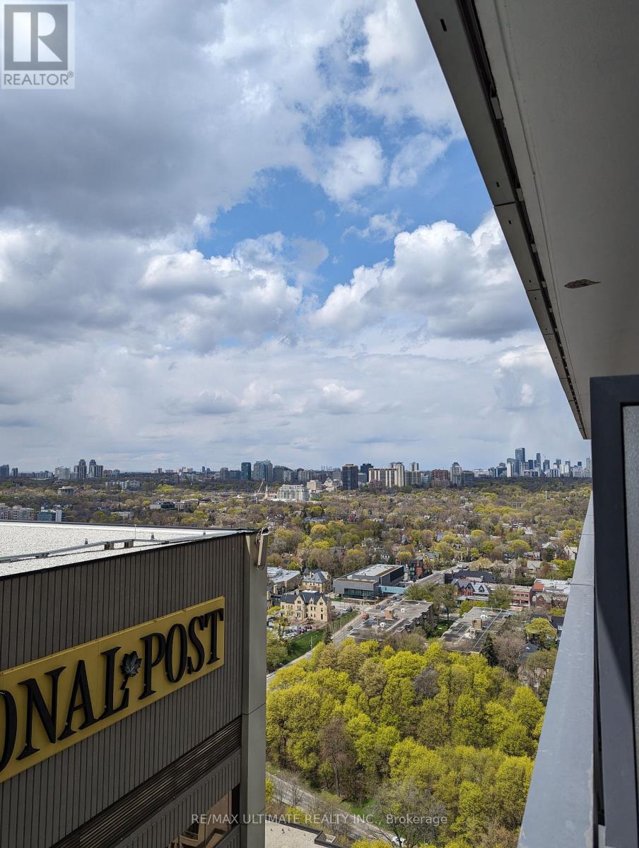 A view from a high vantage point looking down at a cityscape with a National Post building in the foreground.
