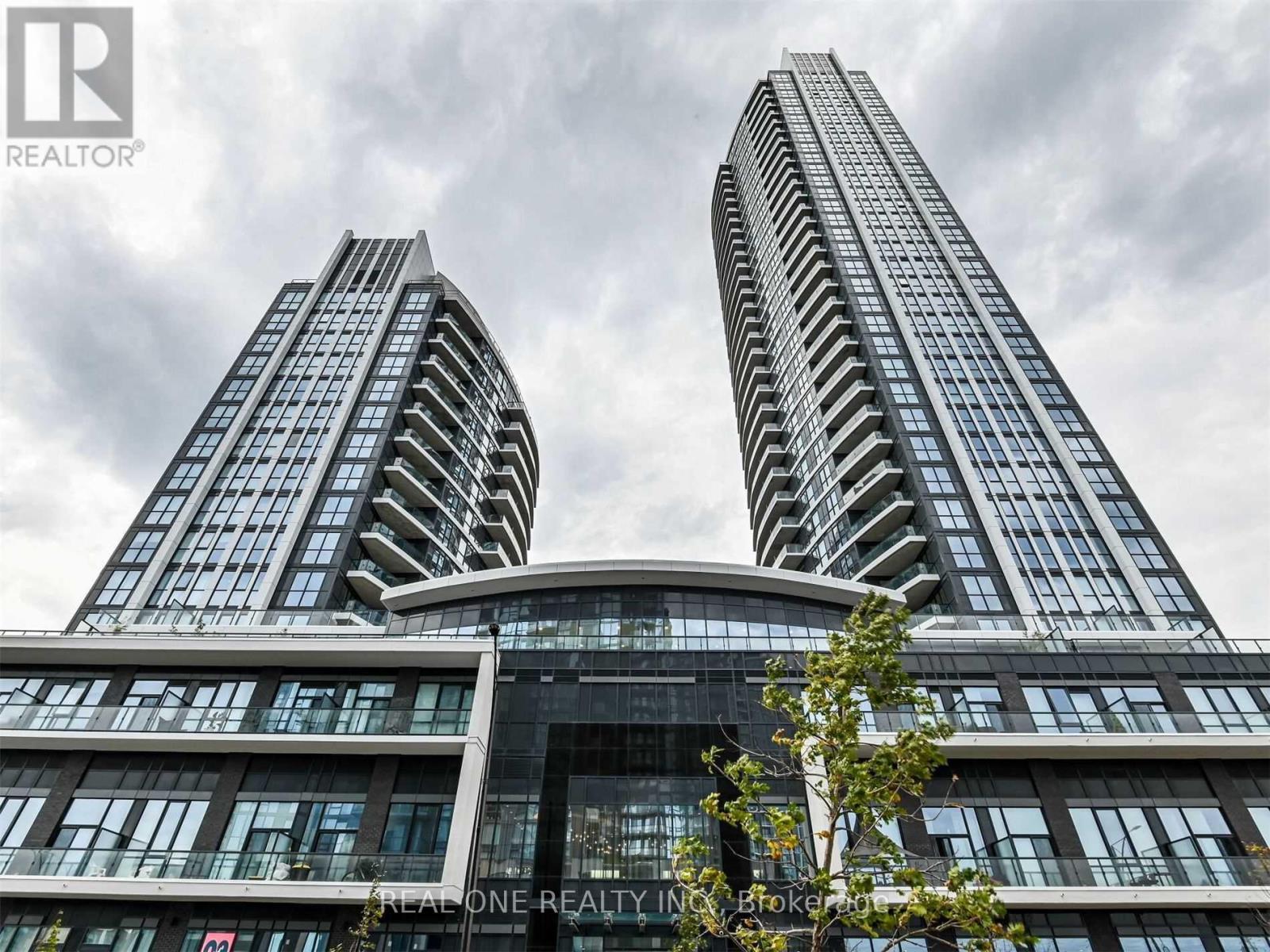 Two tall buildings with the words "REALONE REALTY" on the front.