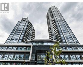 Two tall buildings with the words "REALONE REALTY" on the front.