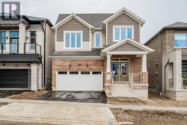 A two-story house with a garage is shown in the image.