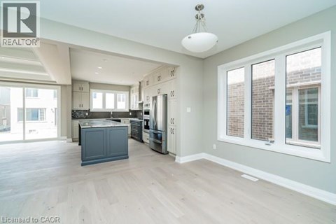 A spacious kitchen with a large island in the middle.