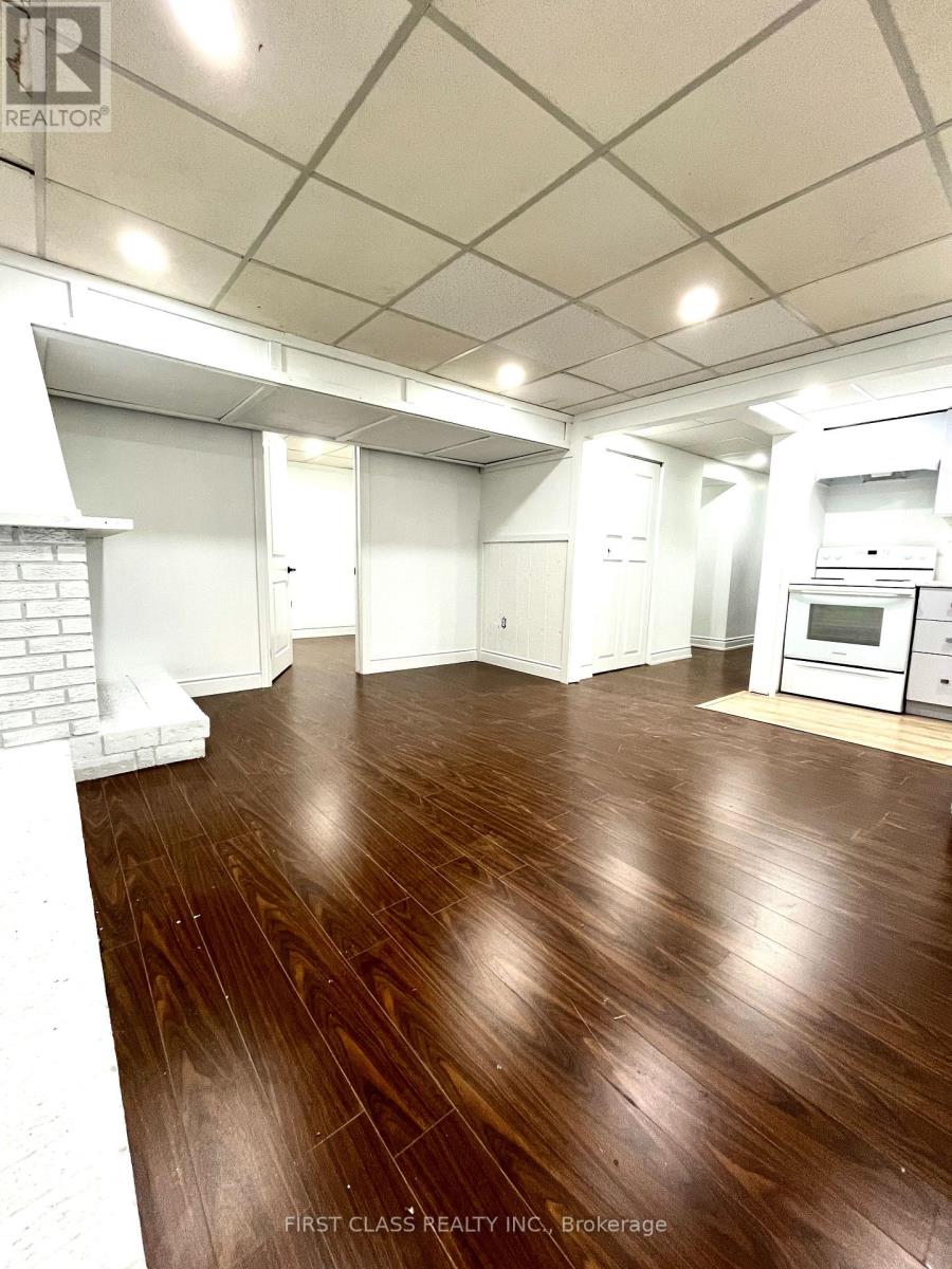 A room with wooden floors and white walls.