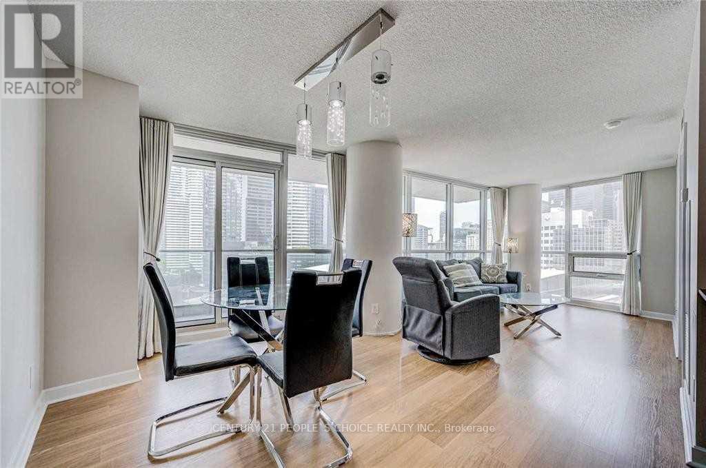 A living room with a glass table and chairs.